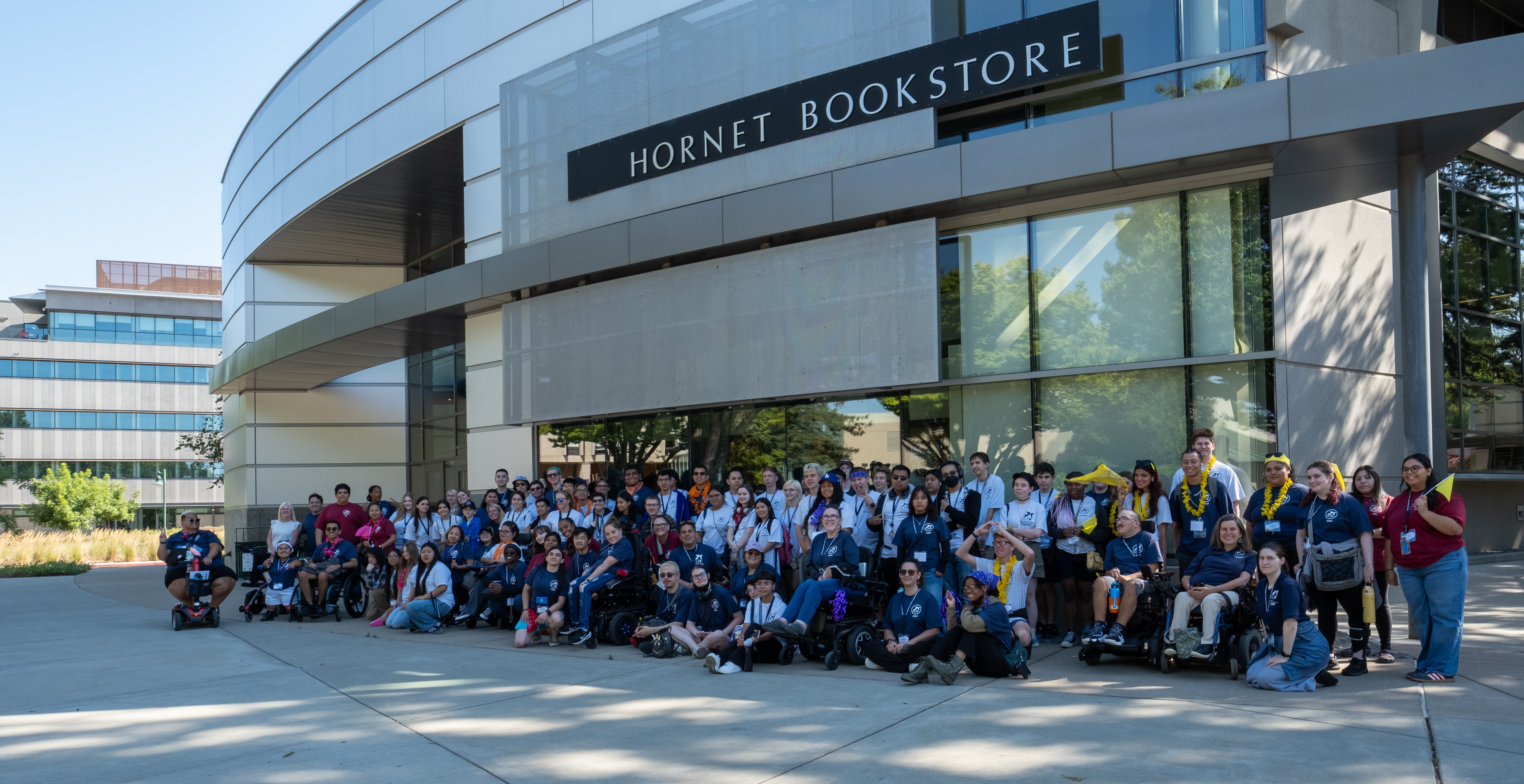 YLF delegates and staff pose outside the Hornet Bookstore