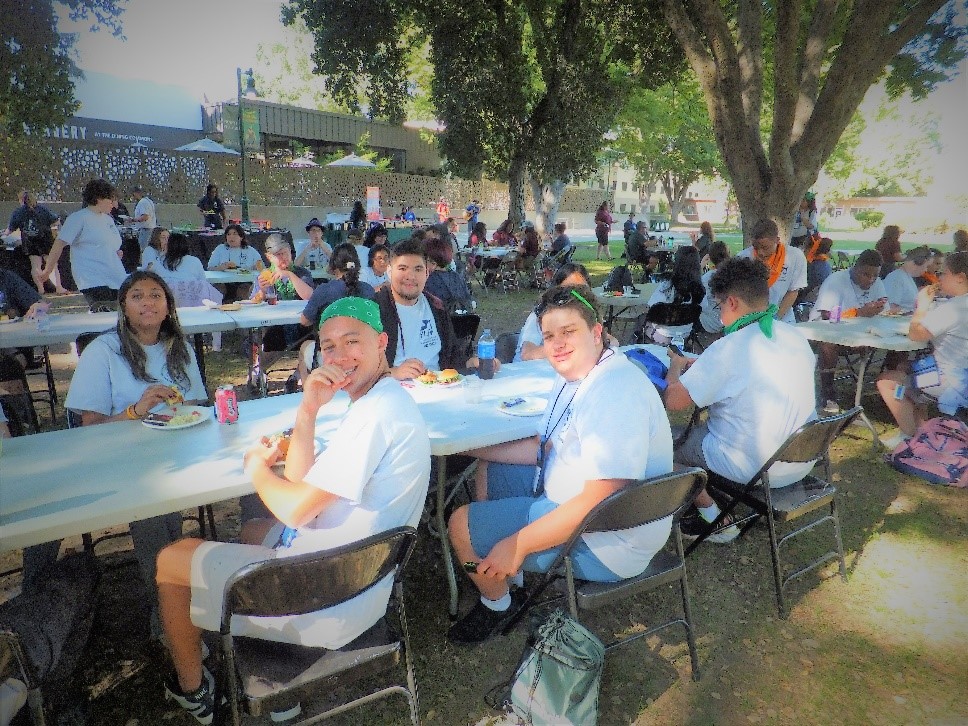 YLF 2023 Delegates pose while enjoying the BBQ